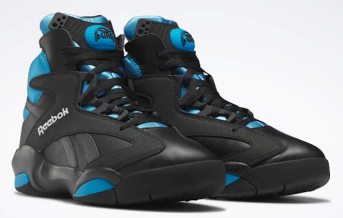 View of black and blue Reebok shoes.